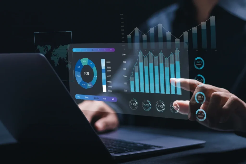 Person sitting and working on a laptop, with SEO analytics charts and upward-trending metrics displayed in front, symbolizing the use of advanced tools for SEO audit success.